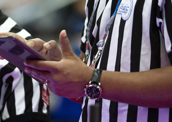 Two VEX referees calculating scores at VEX Worlds.